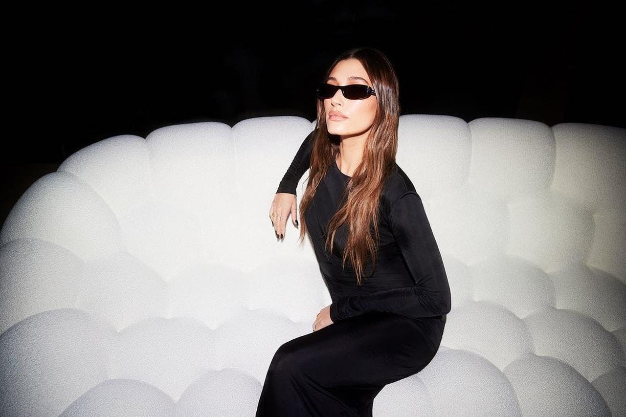 sunglasses adult female person woman sleeve portrait sitting pants long sleeve