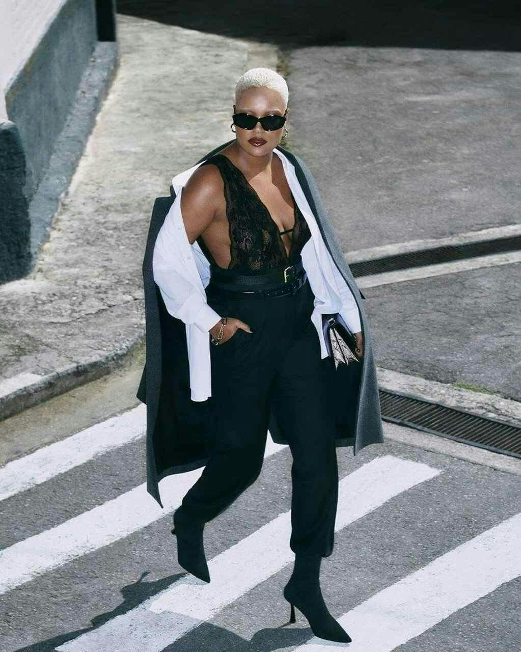 pedestrian person lady clothing coat pants road tarmac blonde hair