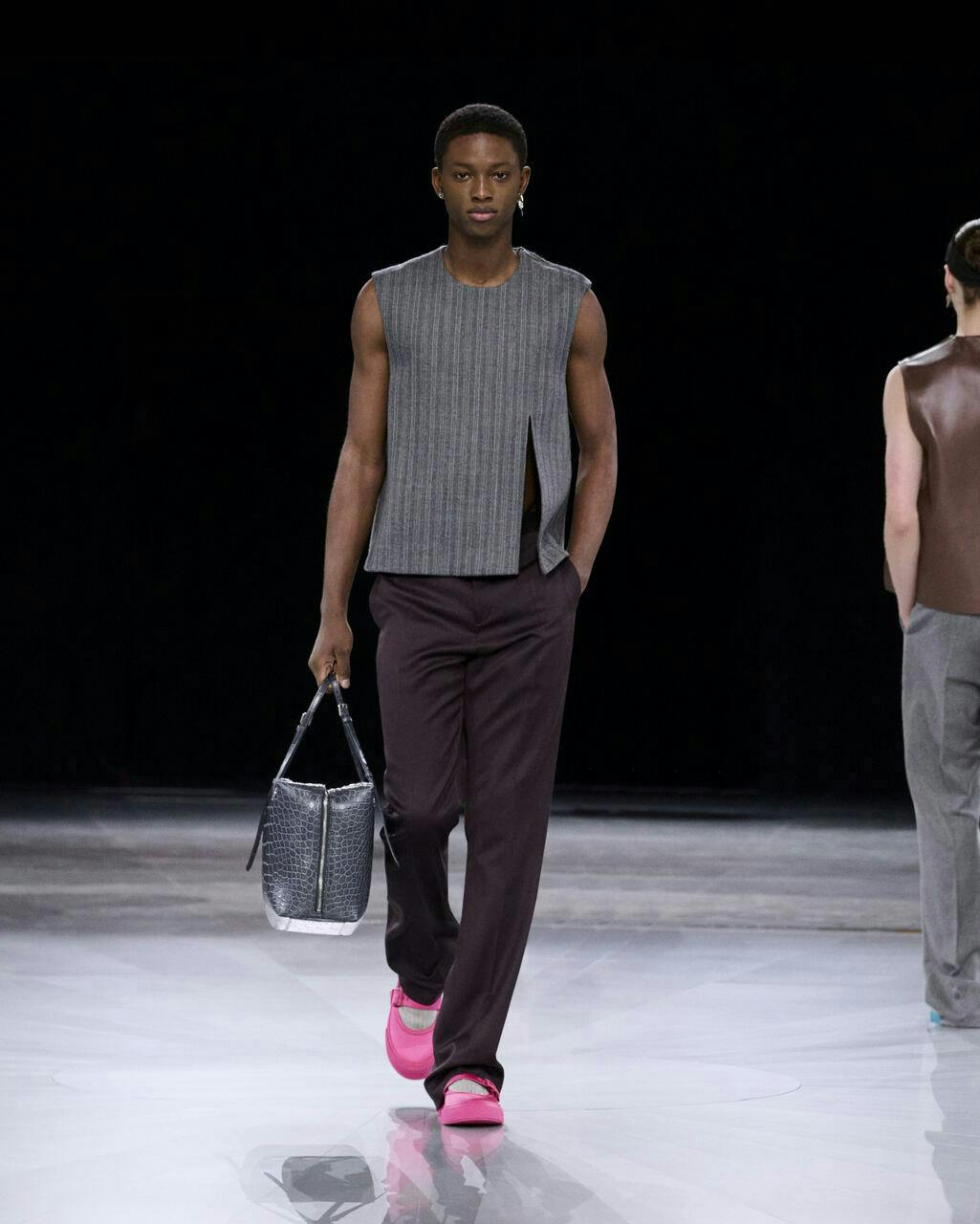 fashion adult male man person bag handbag clothing vest standing