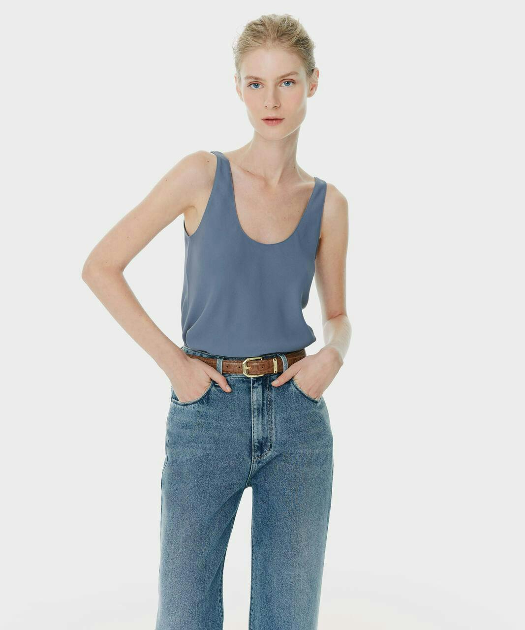 clothing pants accessories belt jeans vest tank top person blouse